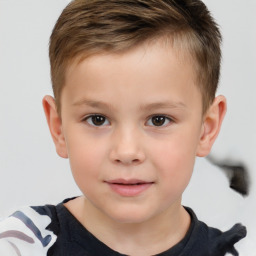 Joyful white child male with short  brown hair and brown eyes