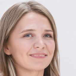 Joyful white young-adult female with long  brown hair and blue eyes