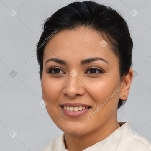 Joyful latino young-adult female with medium  brown hair and brown eyes