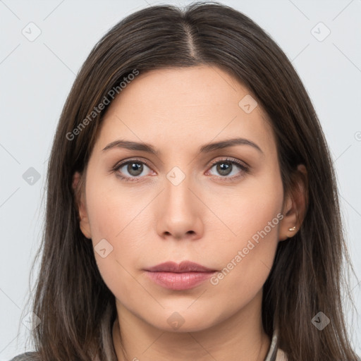 Neutral white young-adult female with long  brown hair and brown eyes