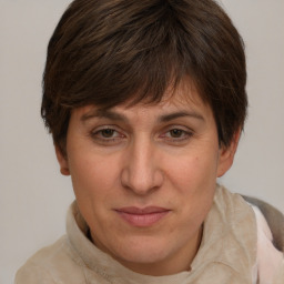 Joyful white adult female with short  brown hair and brown eyes