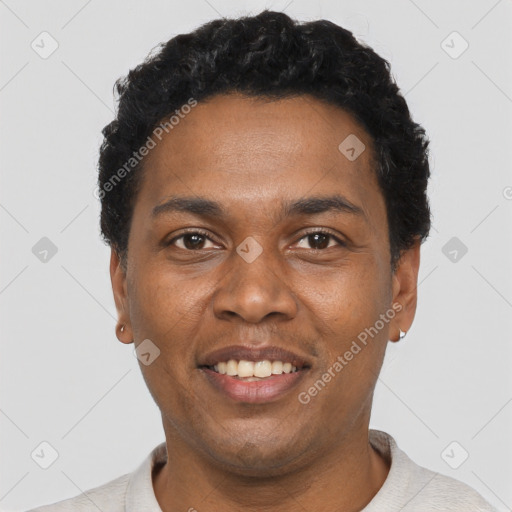 Joyful black young-adult male with short  black hair and brown eyes