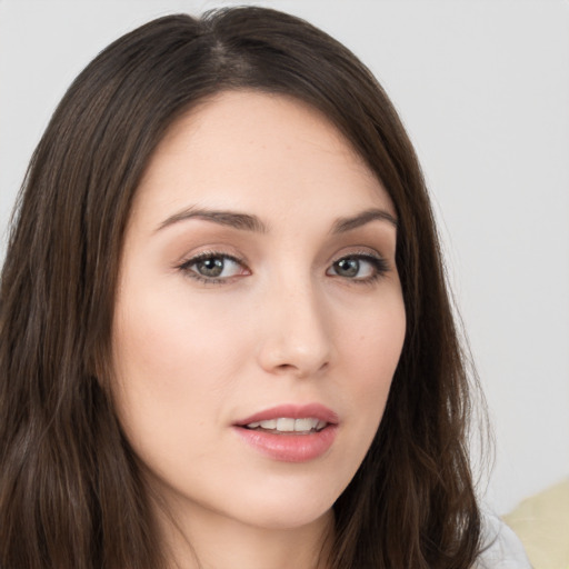 Neutral white young-adult female with long  brown hair and brown eyes