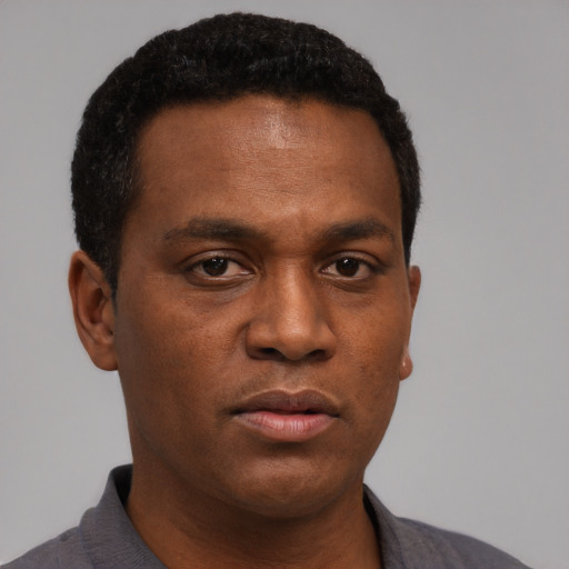Neutral black young-adult male with short  black hair and brown eyes