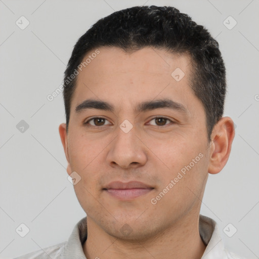 Joyful white young-adult male with short  black hair and brown eyes