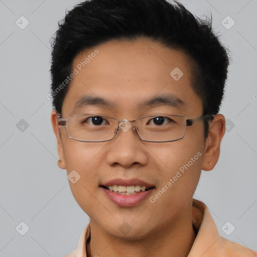 Joyful asian young-adult male with short  brown hair and brown eyes