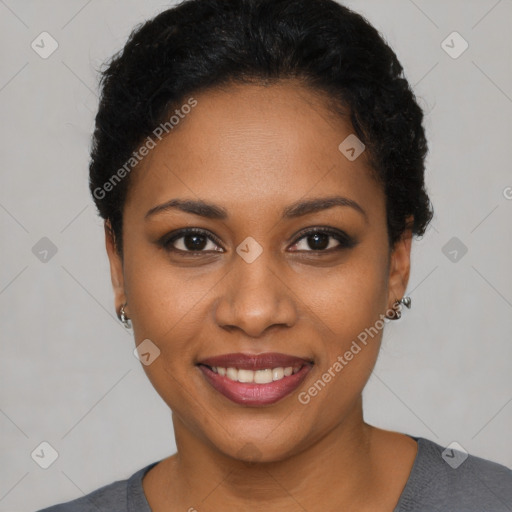 Joyful black young-adult female with short  black hair and brown eyes