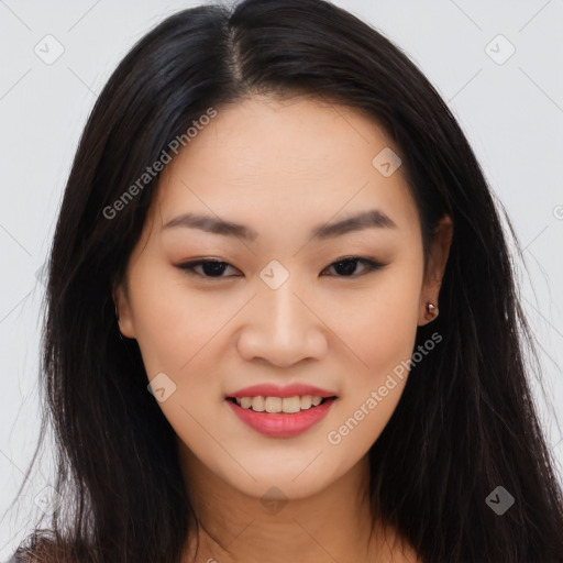 Joyful asian young-adult female with long  brown hair and brown eyes