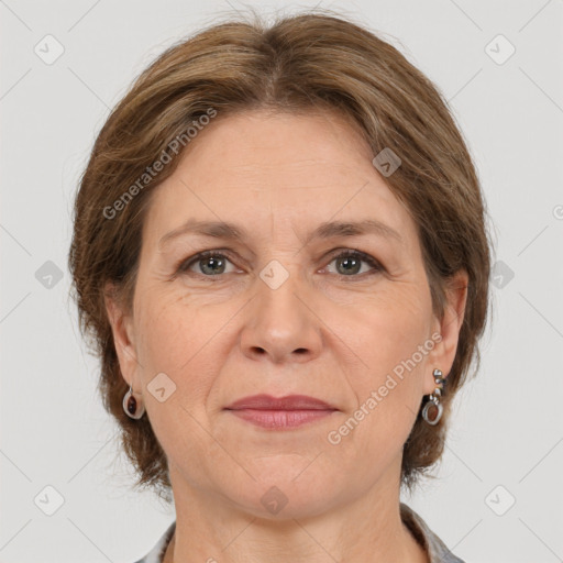 Joyful white adult female with medium  brown hair and brown eyes