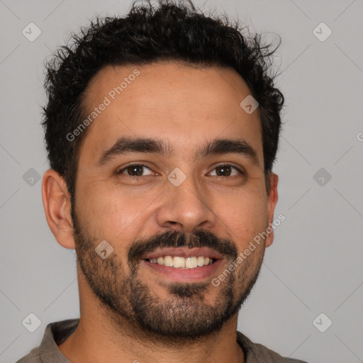 Joyful latino young-adult male with short  brown hair and brown eyes