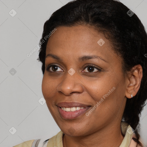 Joyful latino young-adult female with short  brown hair and brown eyes