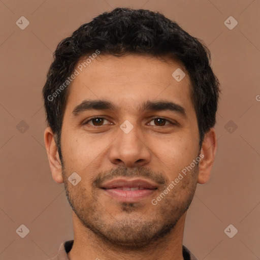Joyful latino young-adult male with short  brown hair and brown eyes