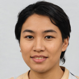 Joyful asian young-adult female with medium  black hair and brown eyes