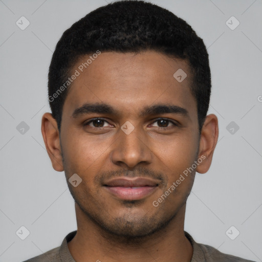 Joyful black young-adult male with short  black hair and brown eyes