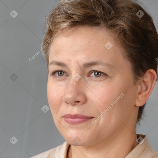 Joyful white adult female with short  brown hair and brown eyes