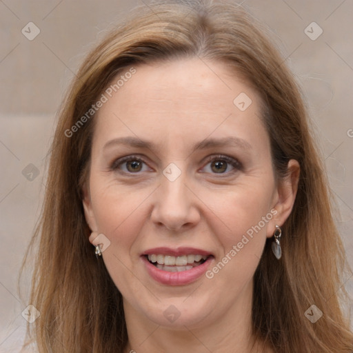 Joyful white adult female with long  brown hair and brown eyes