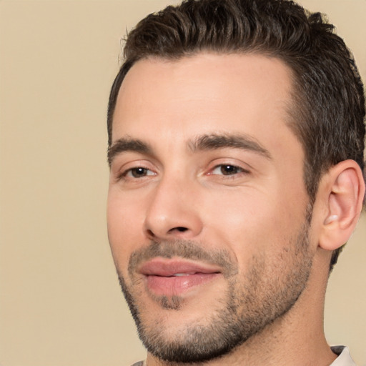 Joyful white young-adult male with short  brown hair and brown eyes