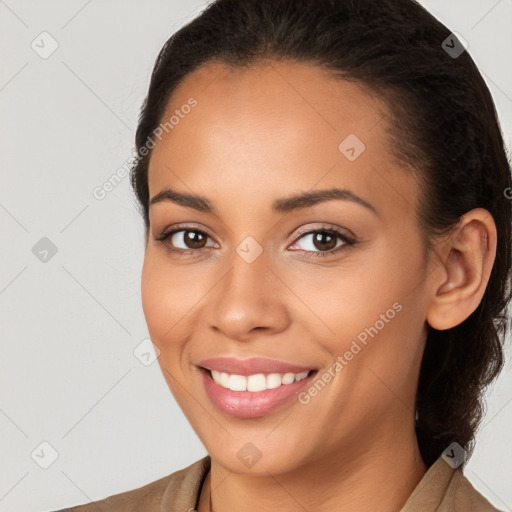 Joyful white young-adult female with long  brown hair and brown eyes