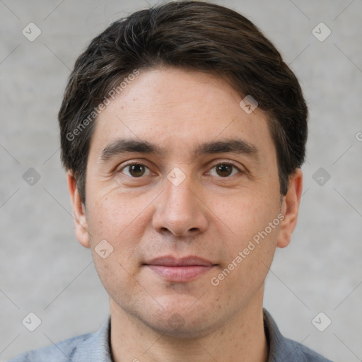 Joyful white adult male with short  brown hair and brown eyes