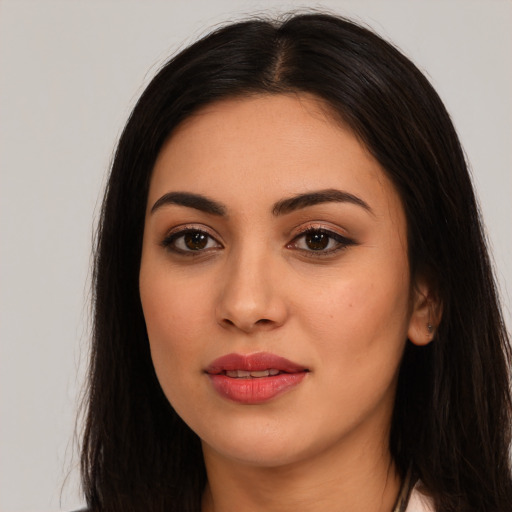 Joyful white young-adult female with long  black hair and brown eyes