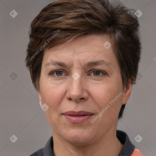 Joyful white adult female with short  brown hair and brown eyes