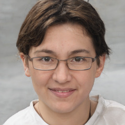 Joyful white adult female with short  brown hair and brown eyes