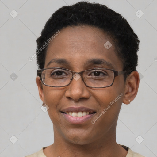 Joyful black adult female with short  brown hair and brown eyes