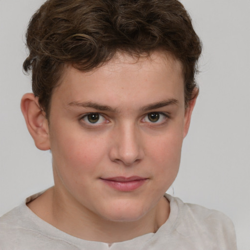 Joyful white child male with short  brown hair and grey eyes