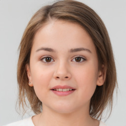 Joyful white child female with medium  brown hair and brown eyes