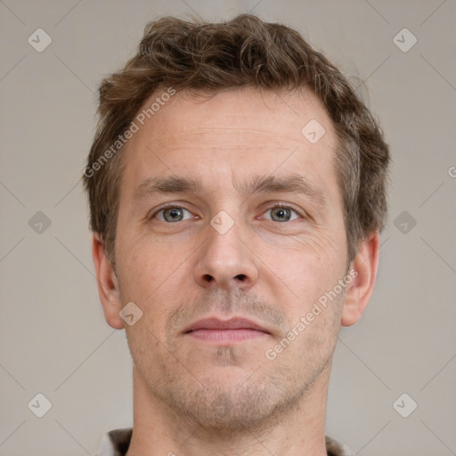 Neutral white adult male with short  brown hair and grey eyes