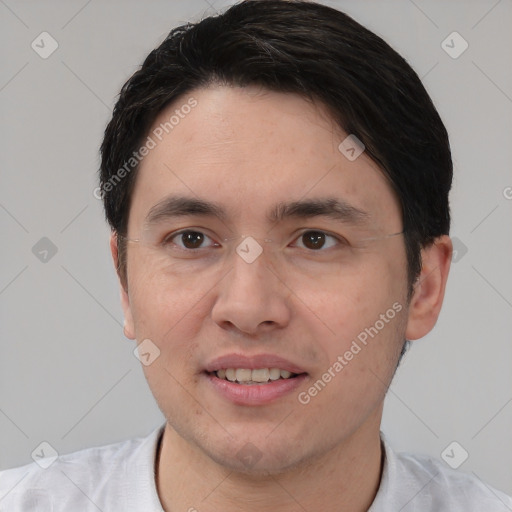 Joyful white young-adult male with short  black hair and brown eyes