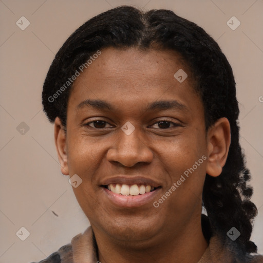 Joyful black young-adult female with short  black hair and brown eyes