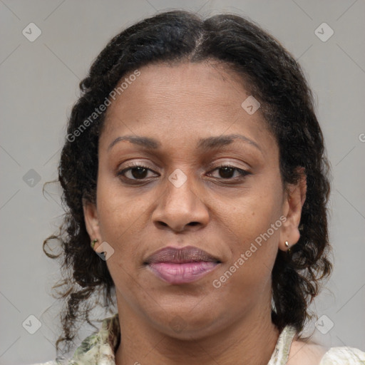 Joyful latino adult female with medium  brown hair and brown eyes