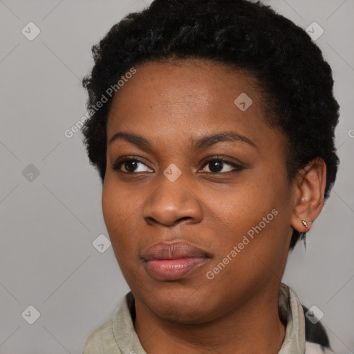 Joyful black young-adult female with short  black hair and brown eyes