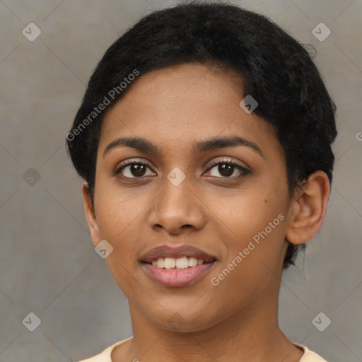 Joyful black young-adult female with short  black hair and brown eyes