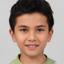 Joyful white child male with short  brown hair and brown eyes