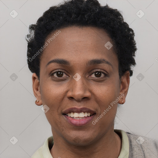 Joyful black young-adult female with short  black hair and brown eyes