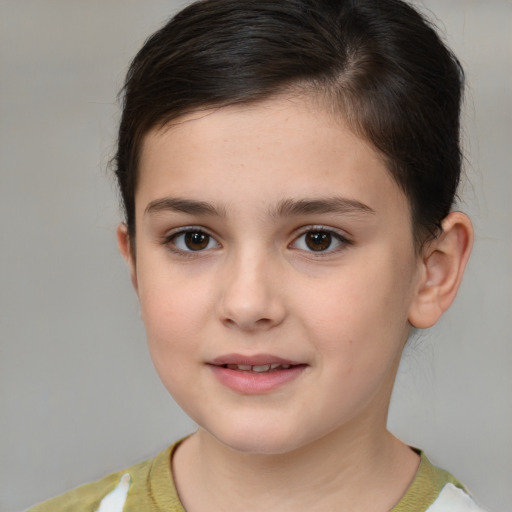 Joyful white child female with short  brown hair and brown eyes