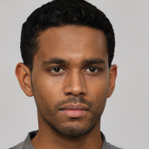 Neutral black young-adult male with short  black hair and brown eyes