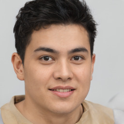 Joyful latino young-adult male with short  brown hair and brown eyes