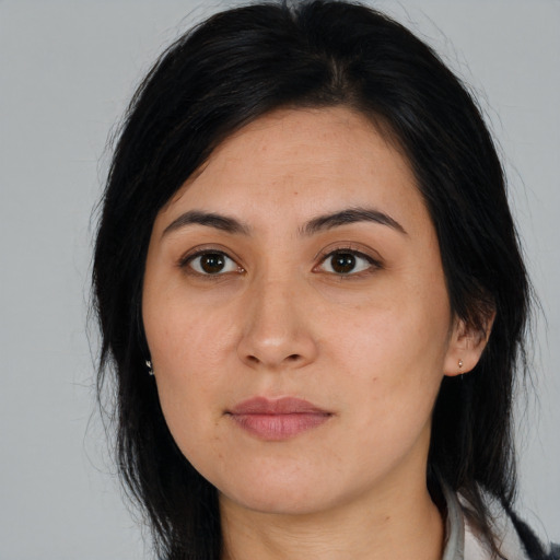 Joyful asian young-adult female with long  black hair and brown eyes
