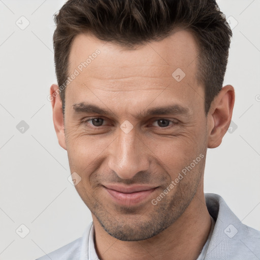 Joyful white adult male with short  brown hair and brown eyes