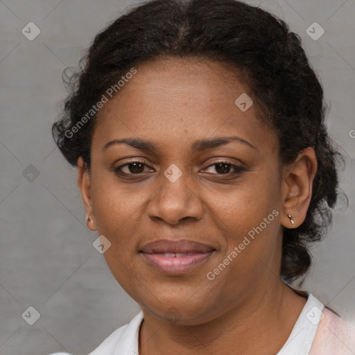 Joyful black adult female with short  brown hair and brown eyes