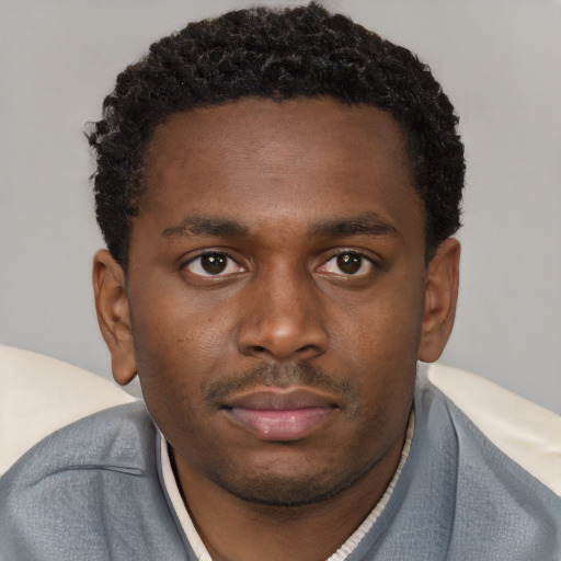 Neutral black young-adult male with short  brown hair and brown eyes