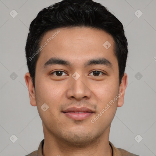 Joyful asian young-adult male with short  black hair and brown eyes