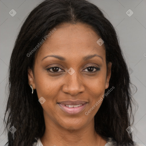 Joyful black young-adult female with long  brown hair and brown eyes