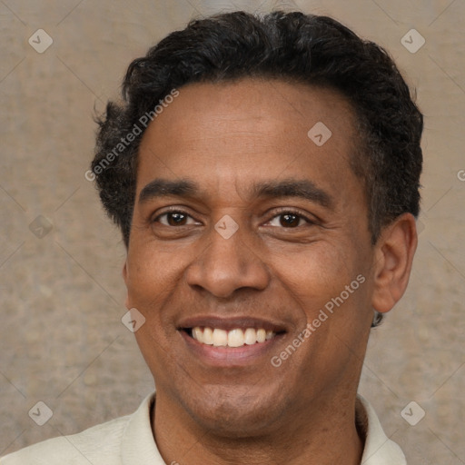 Joyful latino adult male with short  brown hair and brown eyes