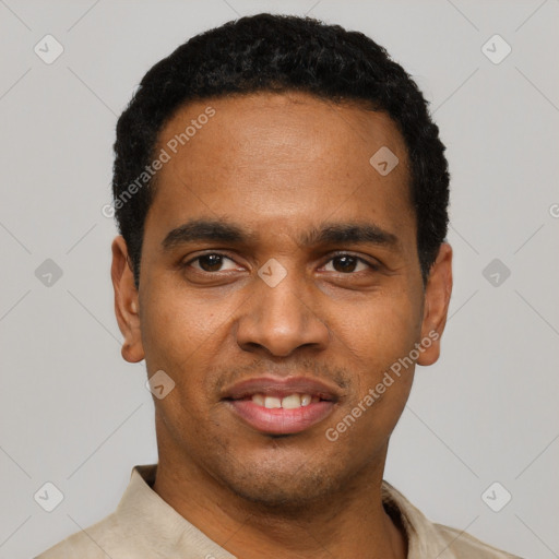 Joyful black young-adult male with short  black hair and brown eyes