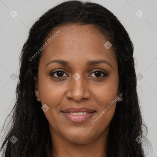 Joyful black young-adult female with long  brown hair and brown eyes