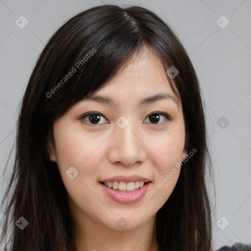 Joyful asian young-adult female with long  brown hair and brown eyes